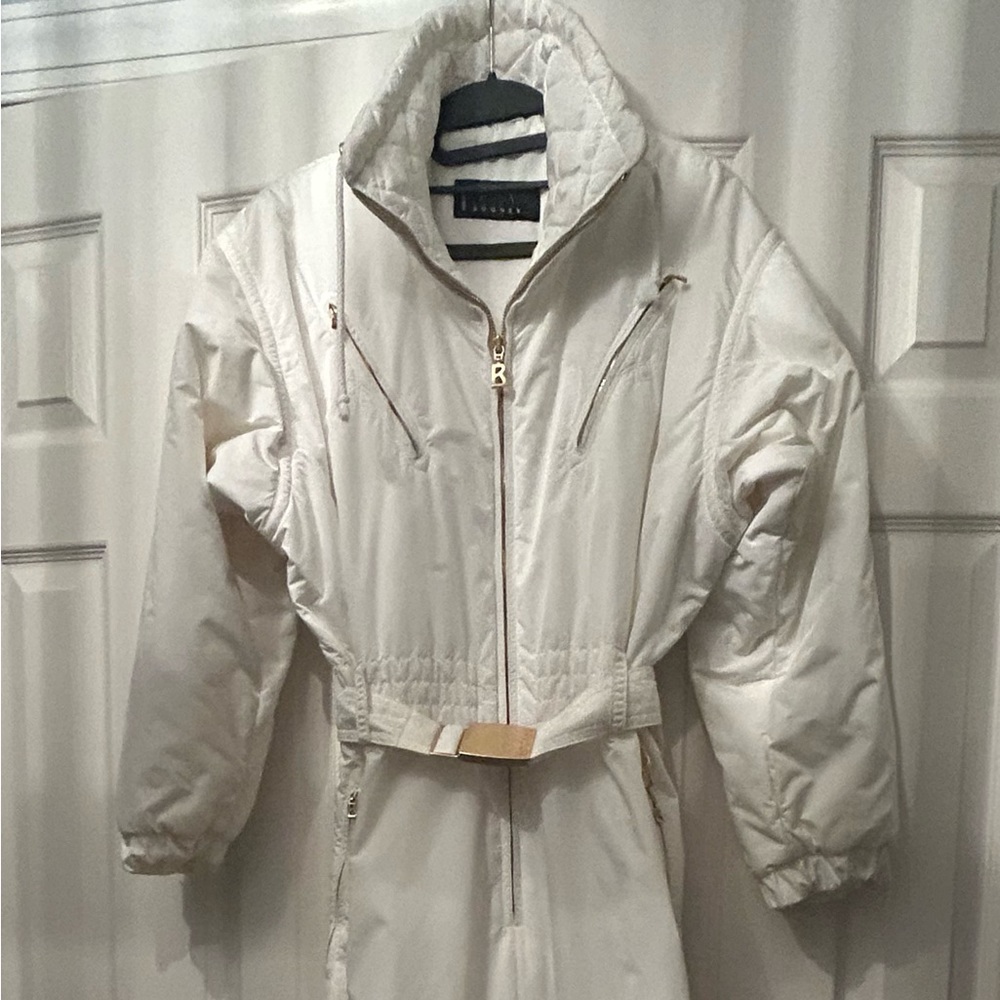 Bogner white one piece ski suit with gold hardware. Size 10